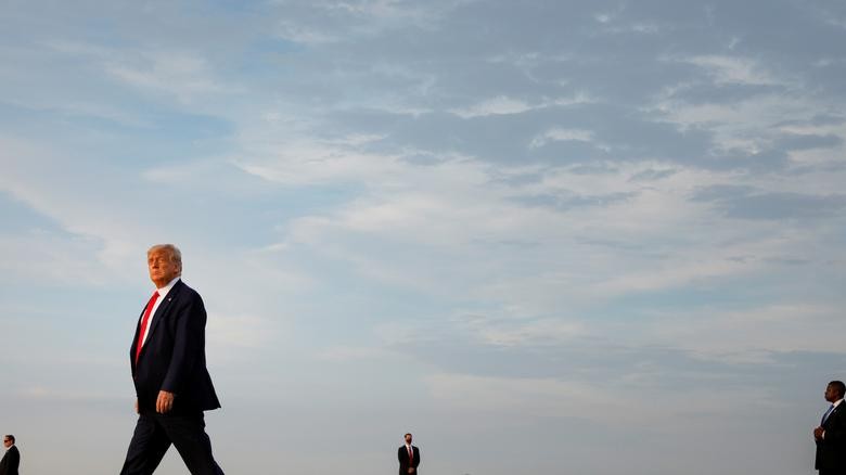 President Donald Trump walks from Air Force One to Marine One following a flight from Maryland, at Morristown Municipal Airport in Morristown, NJ. REUTERS/Tom Brenner
